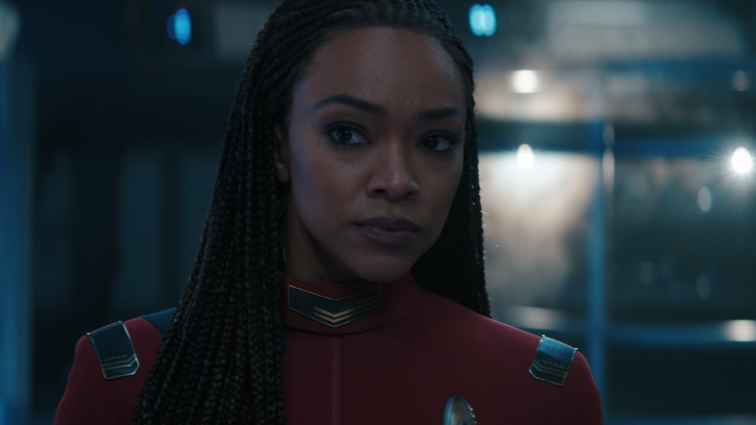 Close-up of Captain Burnham reviewing new data in the Science Lab in 'Jinaal'