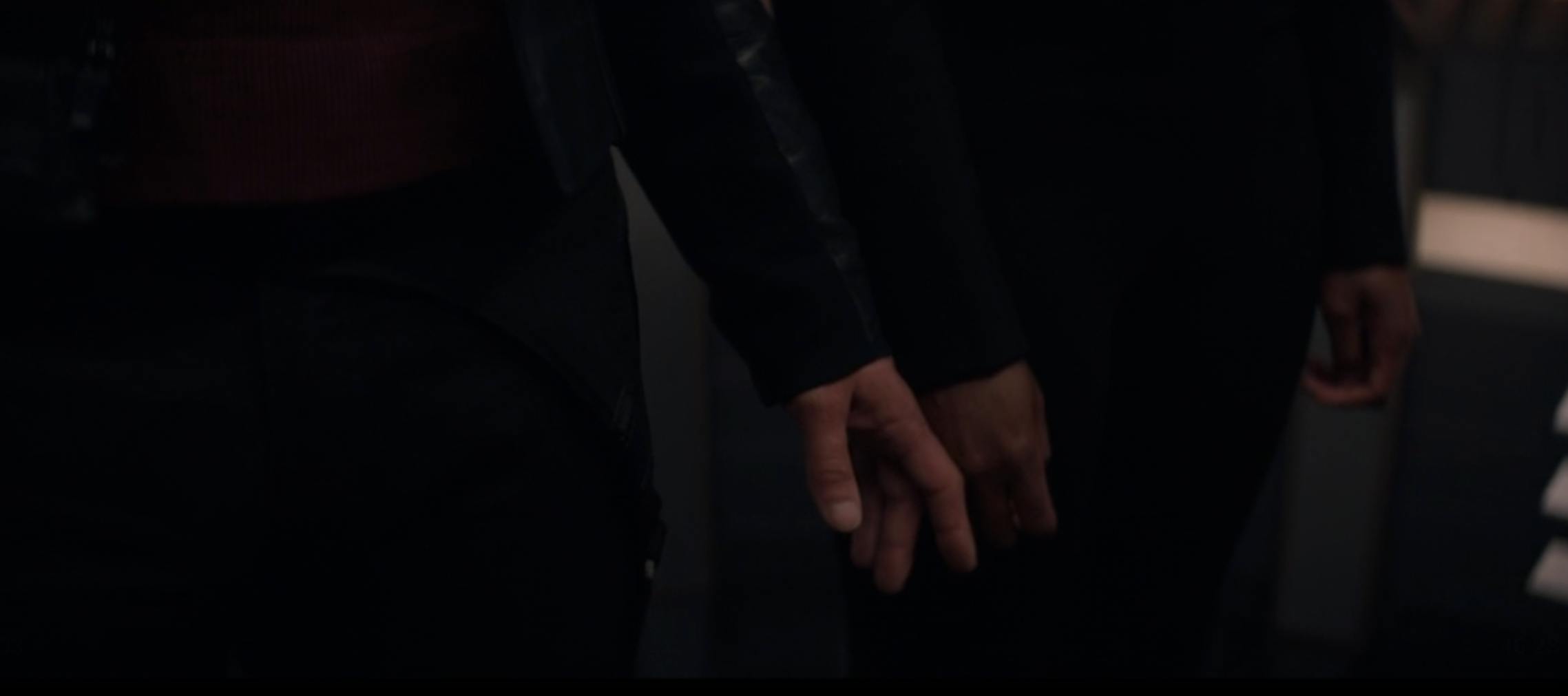 Jack Crusher's hand grazes Sidney La Forge's hand in the turbolift