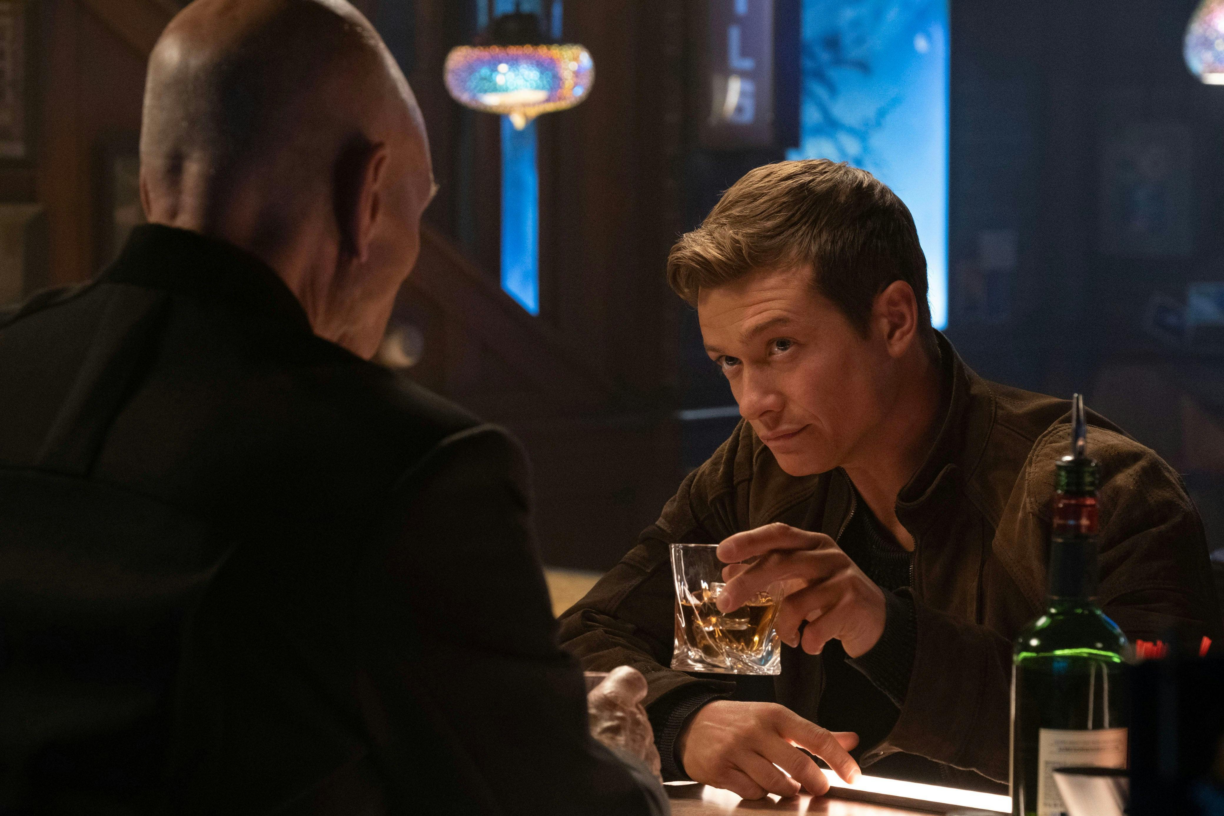 Jack Crusher raises his glass to Admiral Picard in the 10 Forward holoprogram